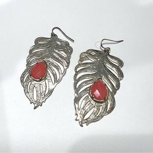 Kendra Scott gold feather earrings with pink stone